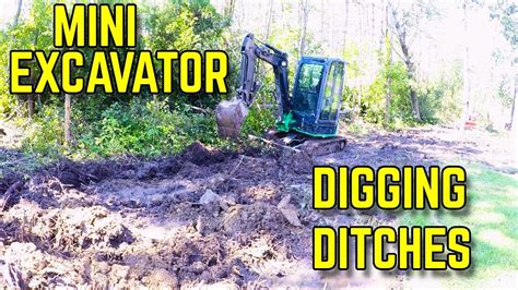 how to get off your ditch with a mini excavator|digging through an open ditch.